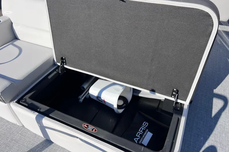 Slide: The Image of Open storage compartment on 2026 Harris 210 Cruiser SLDH boat, showcasing interior space. - 28