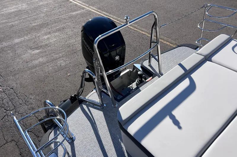 Slide: The Image of 2026 Harris 210 Cruiser SLDH boat with Mercury outboard motor and cushioned seating. - 30