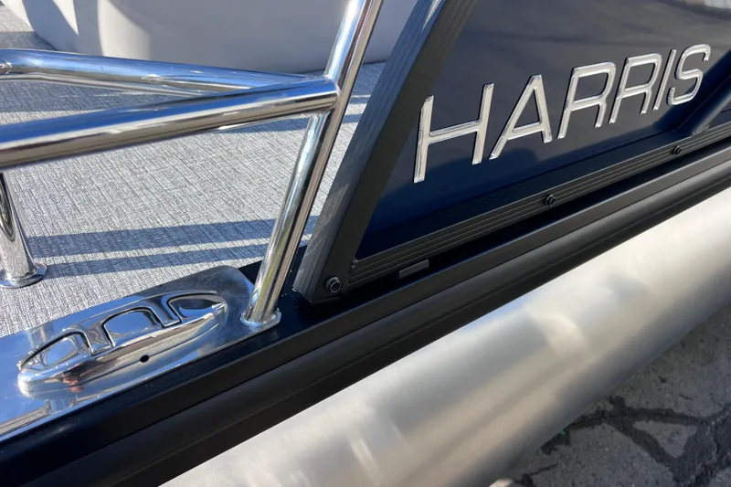 Slide: The Image of 2026 Harris 210 Cruiser SLDH pontoon boat with sleek metal detailing. - 31