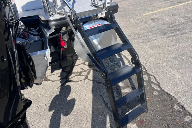Slide: The Image of 2026 Harris 210 Cruiser SLDH boat ladder on asphalt, showcasing sturdy design and craftsmanship. - 7