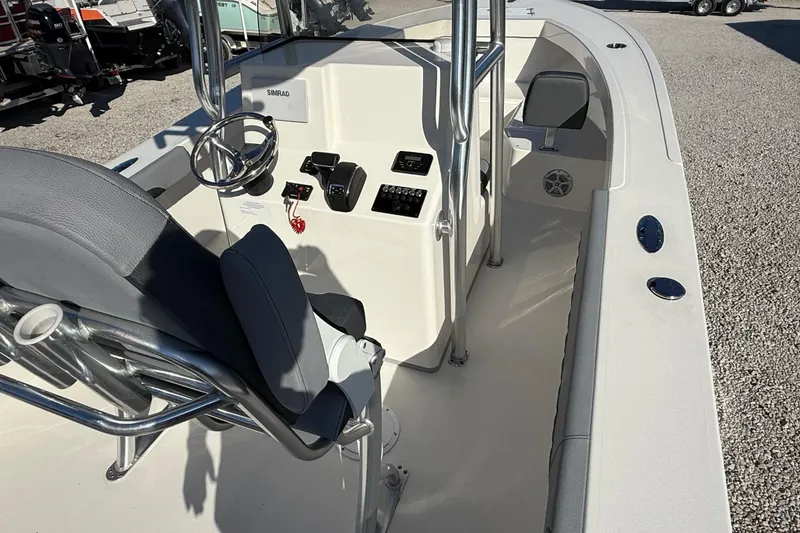 Slide: The Image of 2025 May-Craft 245 Offshore CC boat interior with steering console and seating. - 18