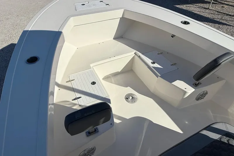 Slide: The Image of 2025 May-Craft 245 Offshore CC boat interior with seating and storage compartments. - 8