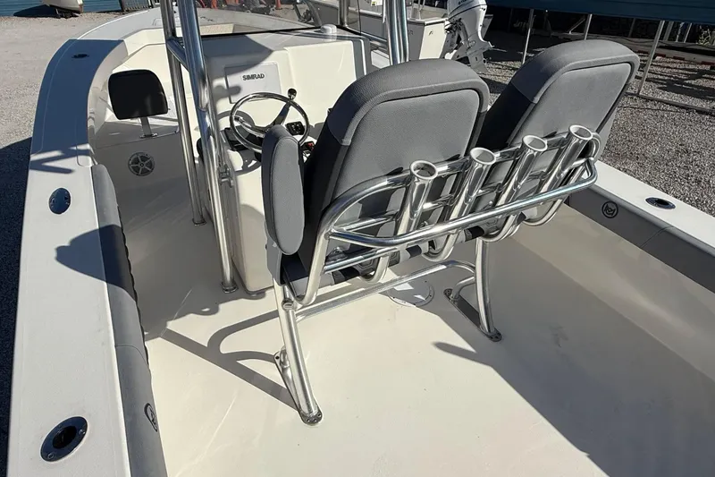 Slide: The Image of 2025 May-Craft 245 Offshore CC boat interior with dual seats and steering console. - 12