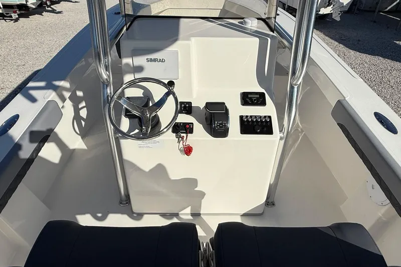 Slide: The Image of 2025 May-Craft 245 Offshore CC boat console with steering wheel and controls. - 13