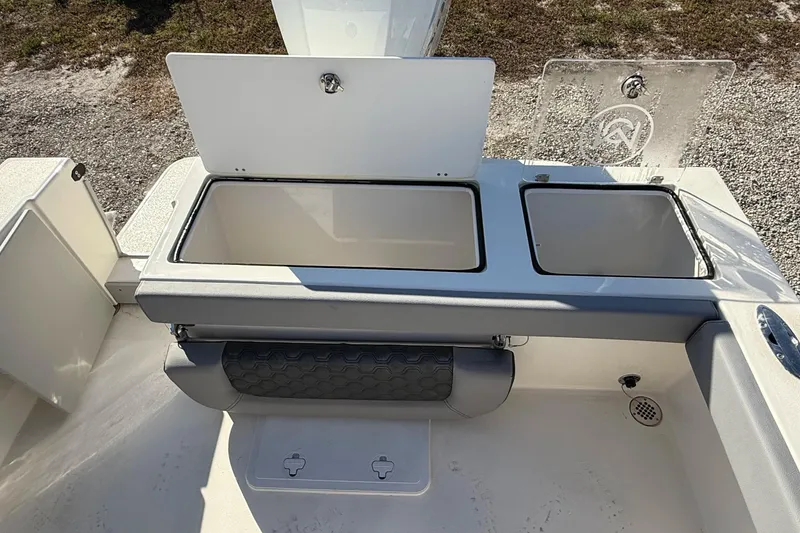 Slide: The Image of 2025 May-Craft 245 Offshore CC boat storage compartments and seating area. - 14