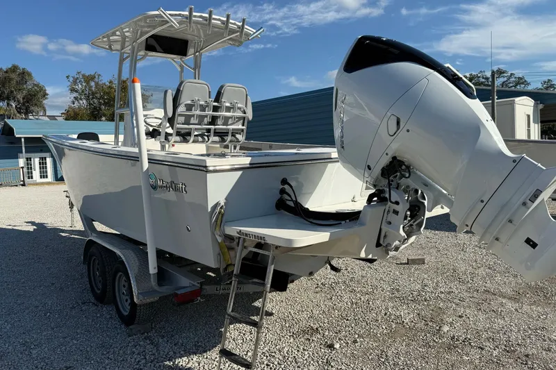 Slide: The Image of 2025 May-Craft 245 Offshore CC boat on trailer with powerful outboard motor. - 3
