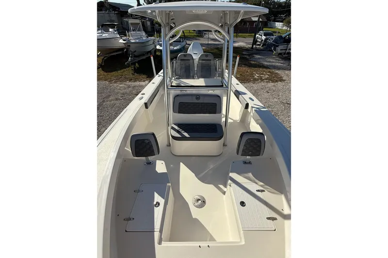 Slide: The Image of 2025 May-Craft 245 Offshore CC boat interior with seating and storage compartments. - 6