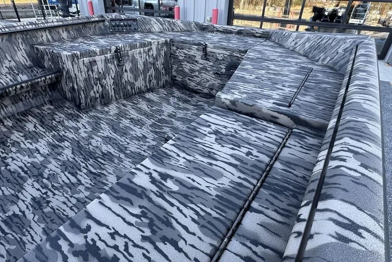 Slide: The Image of 2026 Havoc 1756 boat interior with camouflage pattern, featuring spacious seating and storage. - 4