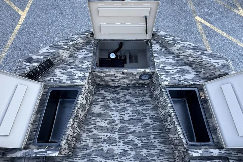 Slide: The Image of Camouflage interior of 2026 Havoc 1756 boat with open storage compartments. - 5