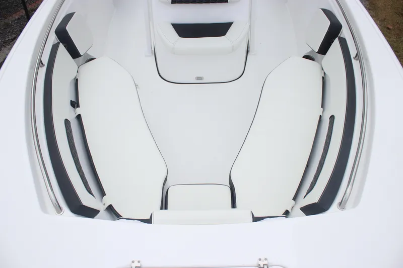 Slide: The Image of 2026 Tidewater 220 LXF boat interior with white cushioned seating. - 15