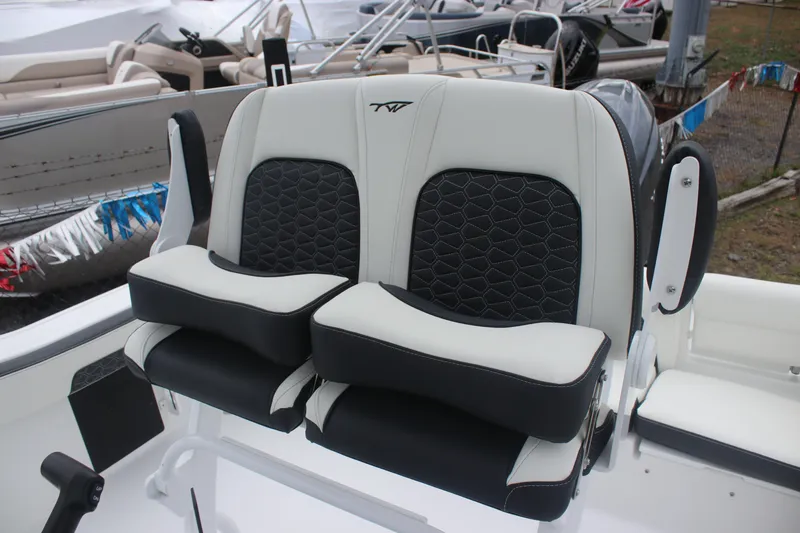 Slide: The Image of 2026 Tidewater 220 LXF boat seats with black and white upholstery, showcasing modern design. - 16