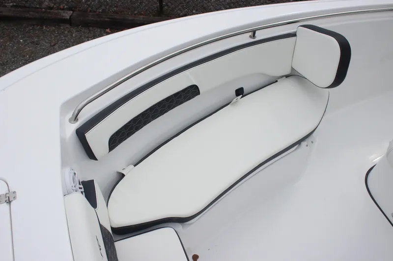 Slide: The Image of 2026 Tidewater 220 LXF boat interior with white cushioned seating and sleek design. - 19