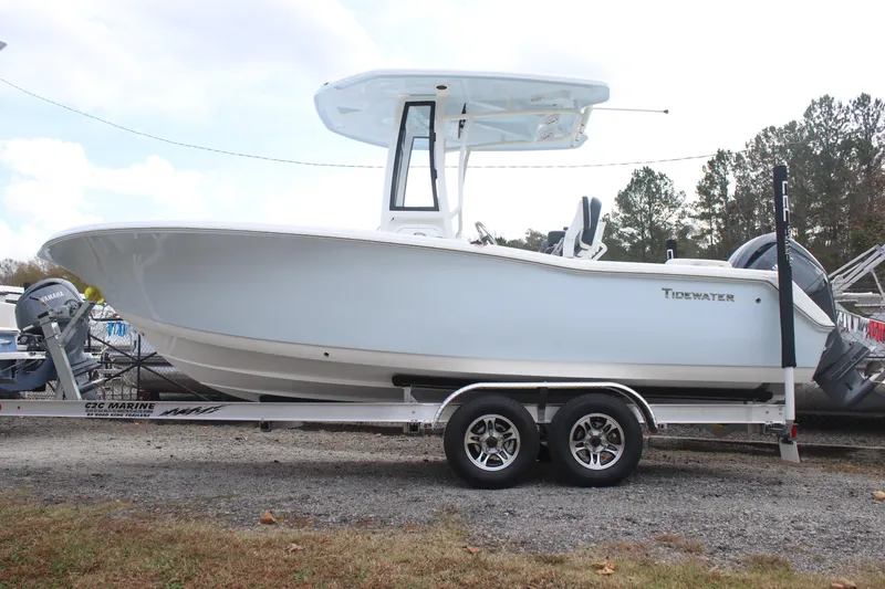 Slide: The Image of 2026 Tidewater 220 LXF boat on trailer, side view, outdoors. - 2