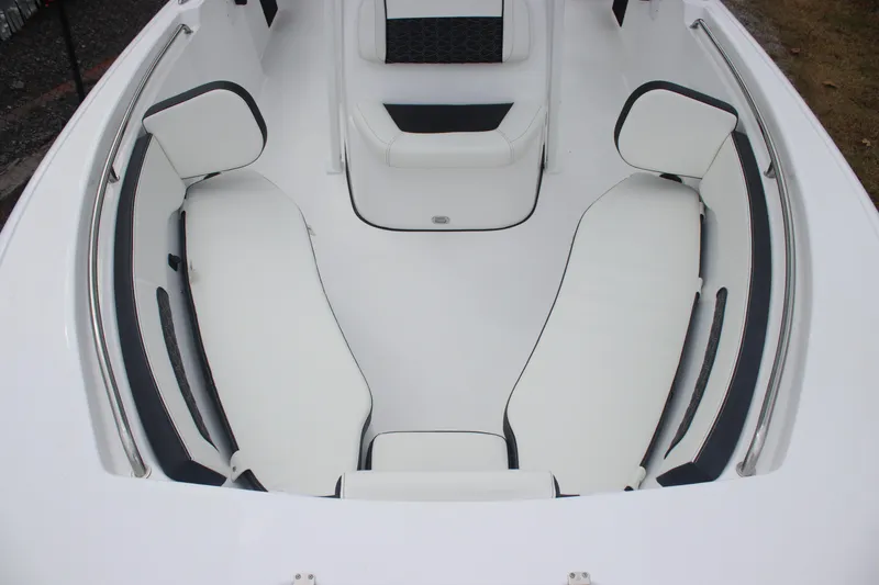 Slide: The Image of 2026 Tidewater 220 LXF boat interior with white cushioned seating. - 20