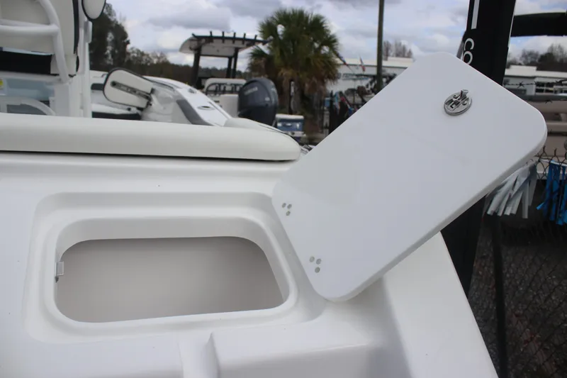 Slide: The Image of 2026 Tidewater 220 LXF boat storage compartment with open hatch, showcasing sleek design. - 22