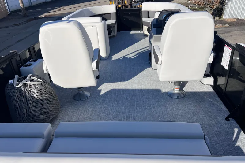 Slide: The Image of 2026 Harris Cruiser 230 SLDH Tritoon interior with plush seating and modern design. - 11