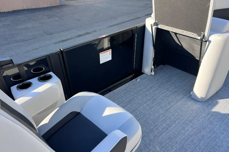 Slide: The Image of 2026 Harris Cruiser 230 SLDH Tritoon interior with seating and cup holders. - 13
