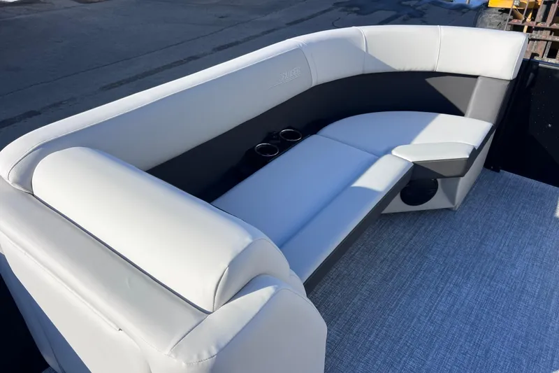 Slide: The Image of Luxurious seating on 2026 Harris Cruiser 230 SLDH Tritoon, featuring sleek design and cup holders. - 14