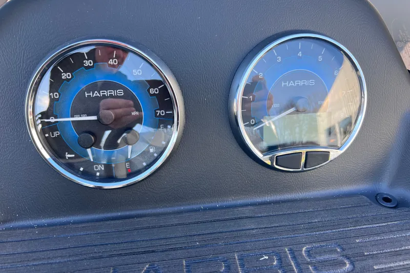 Slide: The Image of Dashboard gauges of 2026 Harris Cruiser 230 SLDH Tritoon boat, showing speedometer and tachometer. - 18