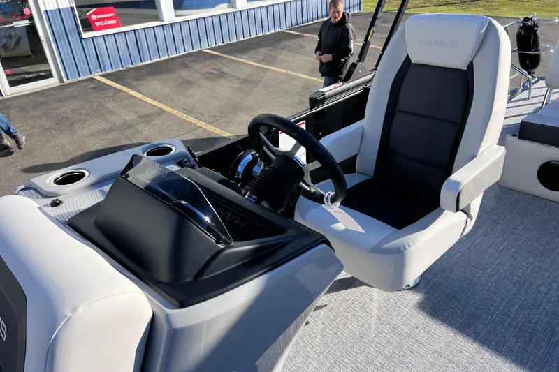 Slide: The Image of 2026 Harris Cruiser 230 SLDH Tritoon helm with modern steering and comfortable seating. - 20