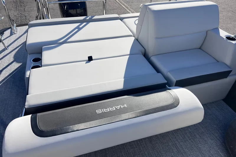 Slide: The Image of 2026 Harris Cruiser 230 SLDH Tritoon with luxurious white seating and cup holders. - 25