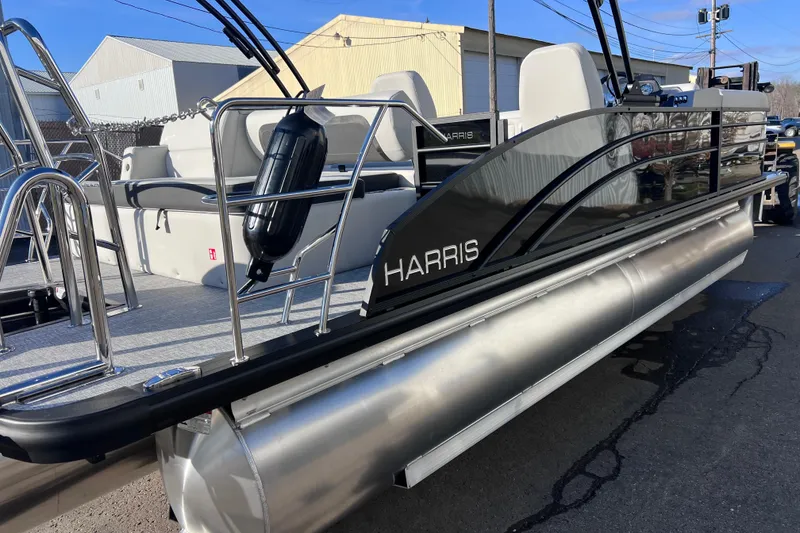 Slide: The Image of 2026 Harris Cruiser 230 SLDH Tritoon boat with sleek design and modern features. - 6