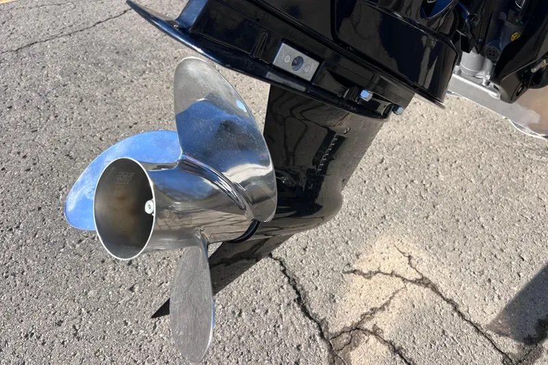 Slide: The Image of Propeller of 2026 Harris Cruiser 230 SLDH Tritoon on pavement background. - 9