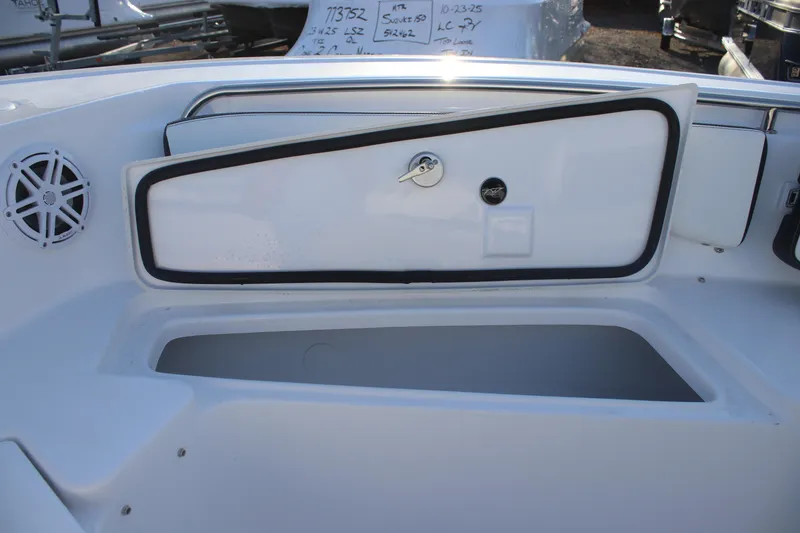 Slide: The Image of 2026 Tidewater 198 CC Adventure boat storage compartment with speaker and lockable hatch. - 12