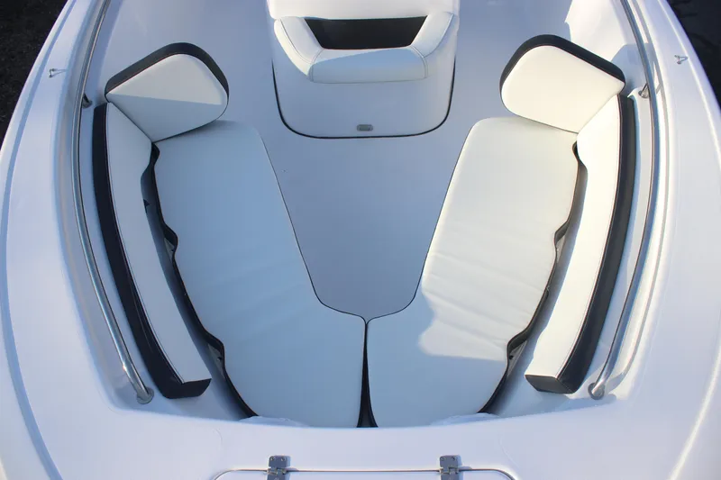 Slide: The Image of 2026 Tidewater 198 CC Adventure boat interior with white cushioned seating. - 13
