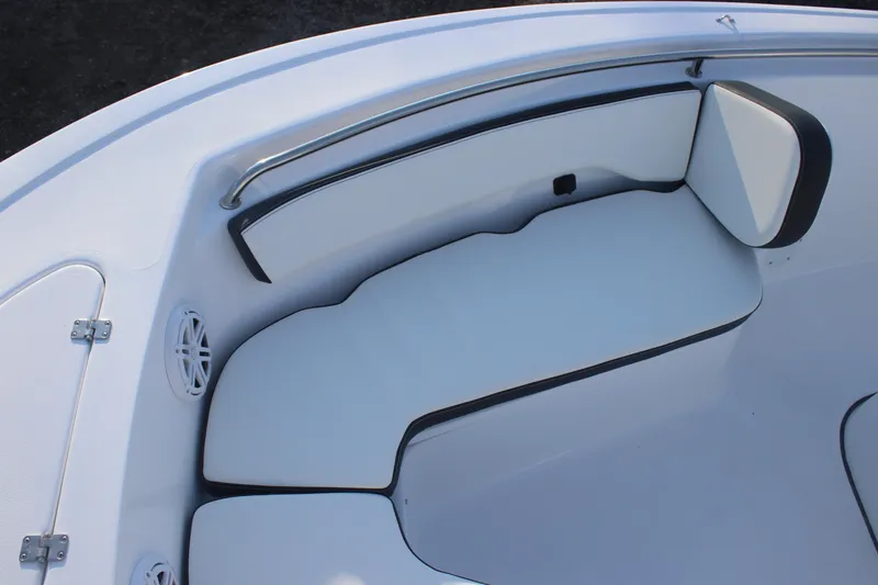 Slide: The Image of 2026 Tidewater 198 CC Adventure boat interior seating with white cushions and stainless steel railing. - 14
