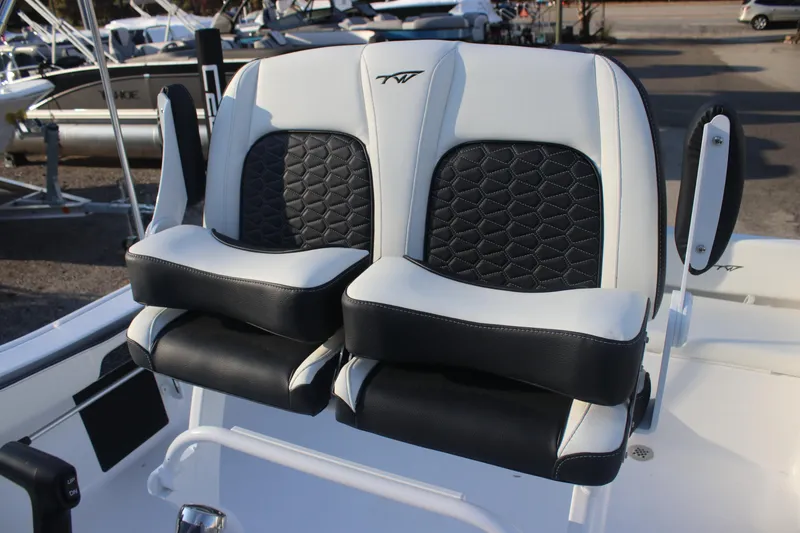 Slide: The Image of 2026 Tidewater 198 CC Adventure boat seats with black and white upholstery. - 16