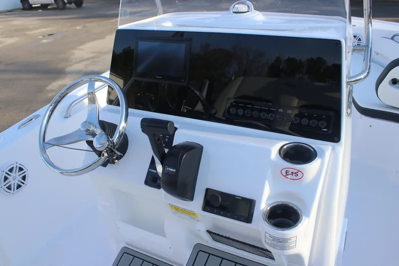 Slide: The Image of 2026 Tidewater 198 CC Adventure boat console with steering wheel and controls. - 19
