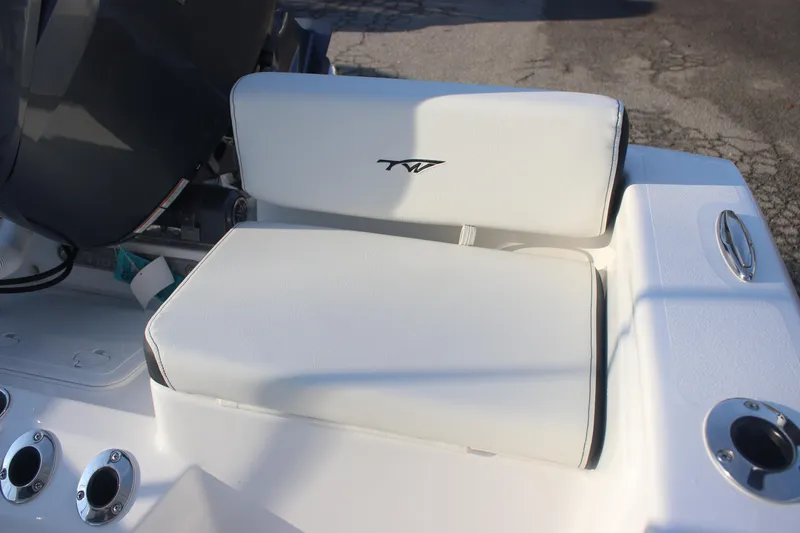Slide: The Image of 2026 Tidewater 198 CC Adventure boat seat with logo, featuring white upholstery and sleek design. - 20