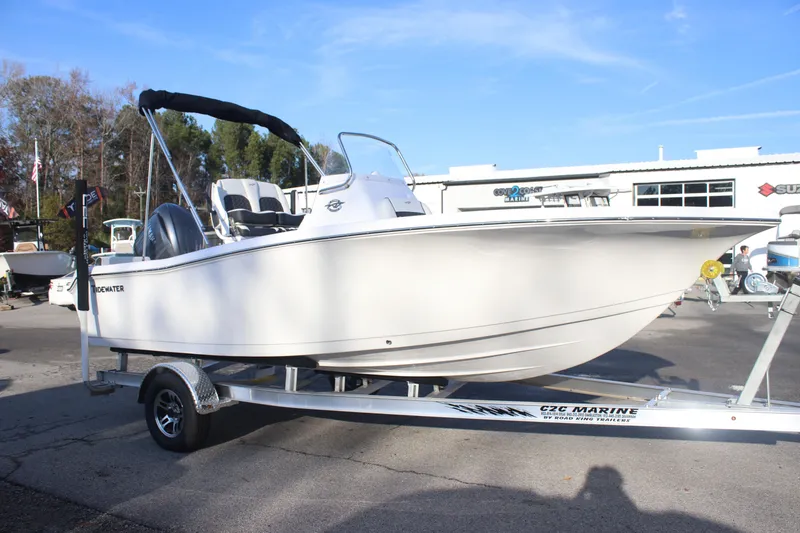 Slide: The Image of 2026 Tidewater 198 CC Adventure boat on trailer, outdoor display. - 4