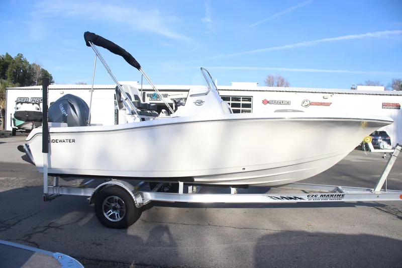 Slide: The Image of 2026 Tidewater 198 CC Adventure boat on trailer, side view, outdoors. - 5