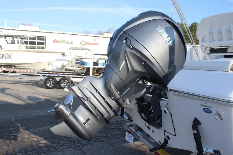 Slide: The Image of 2026 Tidewater 198 CC Adventure boat with Yamaha outboard motor, parked at a dealership. - 9