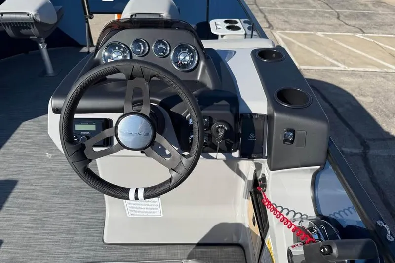 Slide: The Image of Steering console of 2025 Lowe LF 194 boat with gauges and controls. - 9