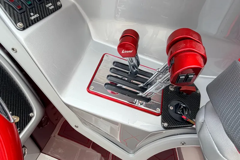 Slide: The Image of Control panel of a 2011 Sunsation F4 boat with red Livorsi throttle levers. - 15