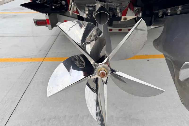 Slide: The Image of Close-up of a 2011 Sunsation F4 boat propeller on a concrete surface. - 19