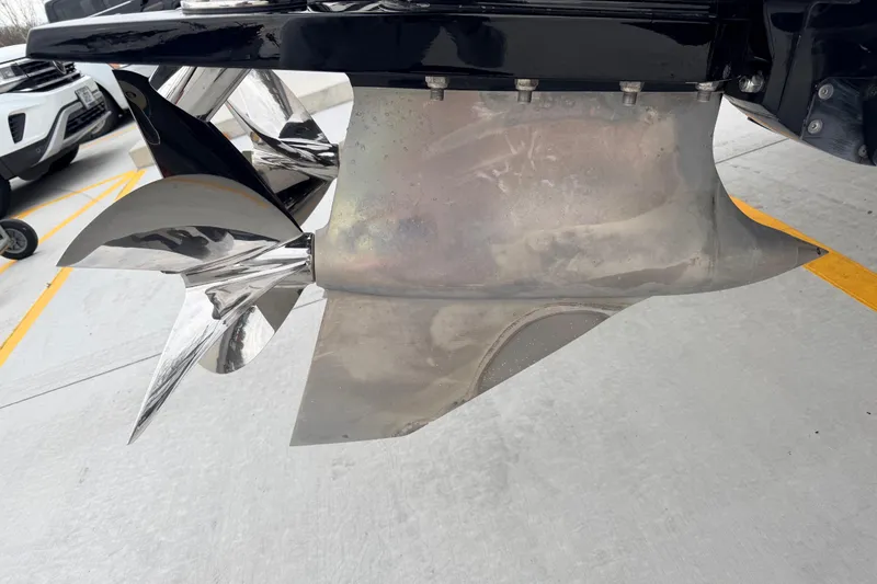 Slide: The Image of Close-up of a 2011 Sunsation F4 boat propeller in a parking area. - 22