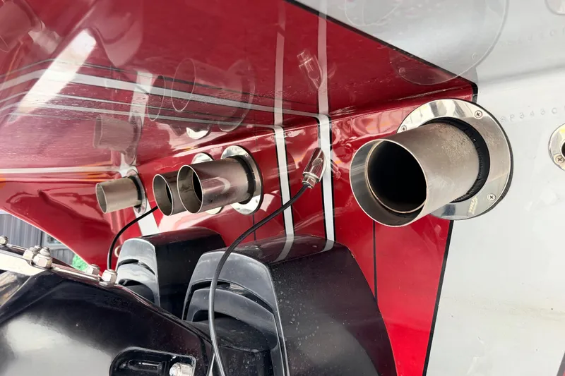 Slide: The Image of 2011 Sunsation F4 boat exhaust system with red and white detailing. - 23