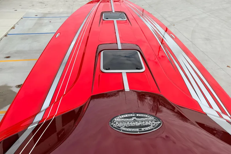 Slide: The Image of Red 2011 Sunsation F4 boat with sleek silver stripes and a polished finish. - 37