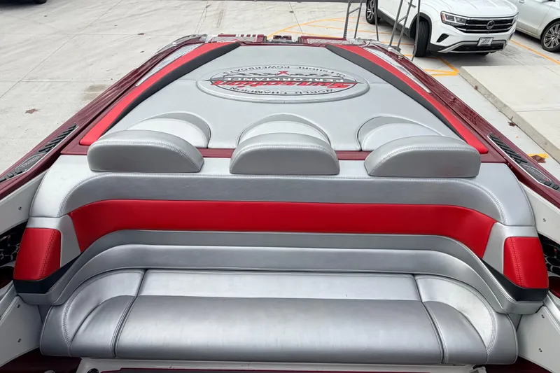 Slide: The Image of 2011 Sunsation F4 boat interior with red and gray seating design. - 38
