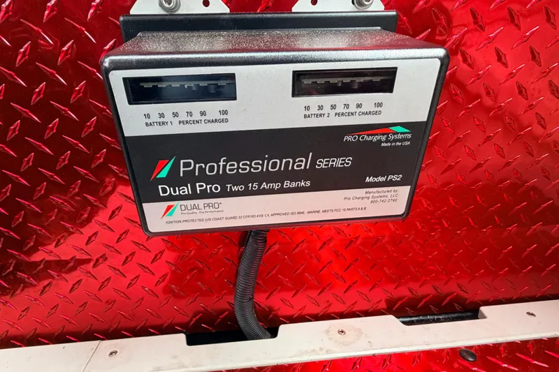 Slide: The Image of Dual Pro battery charger on red diamond plate background, Sunsation F4 2011 model. - 39