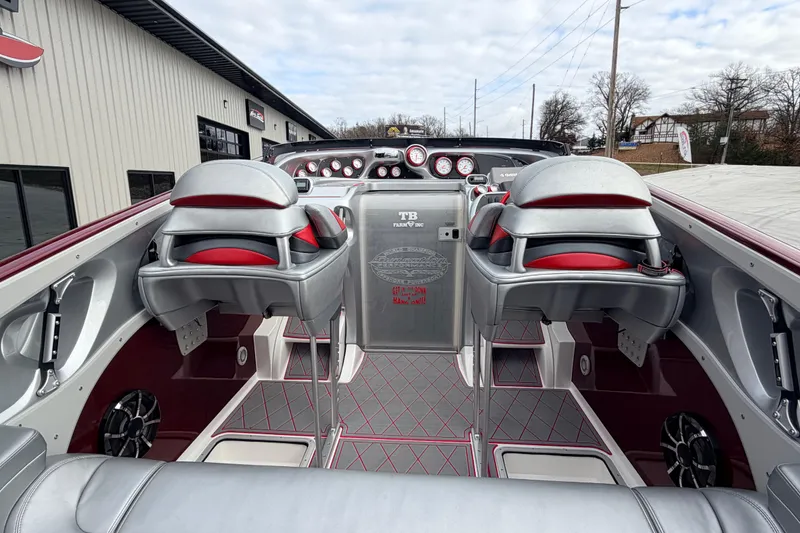 Slide: The Image of Interior of a 2011 Sunsation F4 boat with sleek seating and modern dashboard. - 40