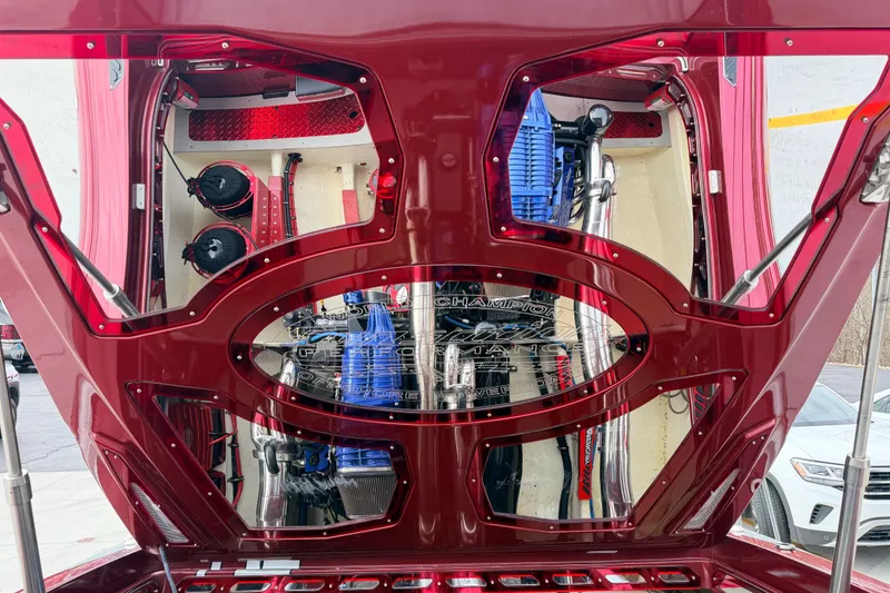 Slide: The Image of 2011 Sunsation F4 engine compartment with red detailing and visible components. - 46