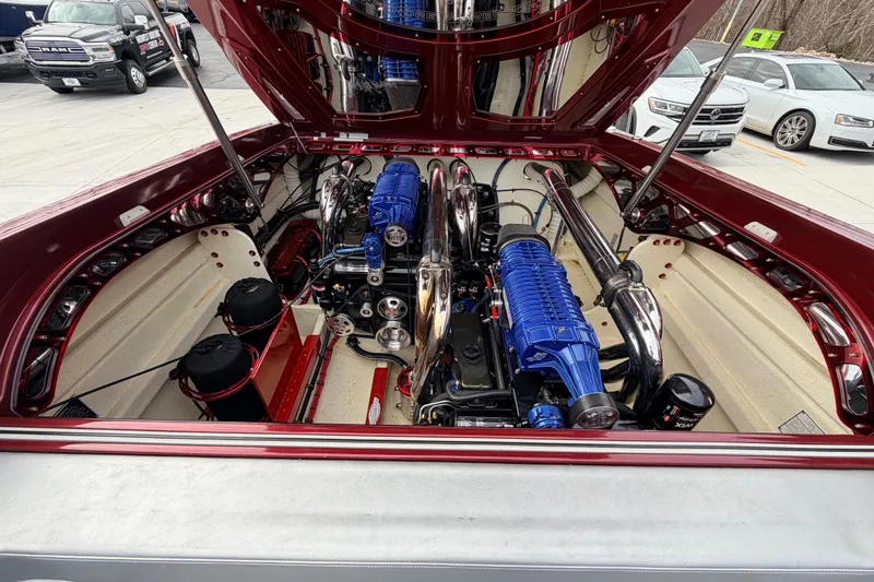 Slide: The Image of 2011 Sunsation F4 boat engine compartment with dual blue engines and polished components. - 48
