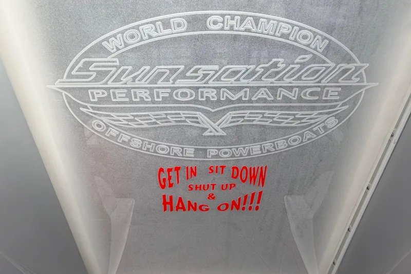 Slide: The Image of 2011 Sunsation F4 powerboat logo with motivational text: 'Get in, sit down, shut up, hang on!' - 50