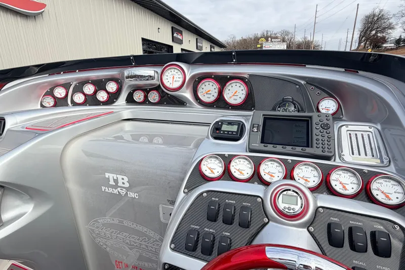 Slide: The Image of 2011 Sunsation F4 boat dashboard with gauges and navigation equipment. - 51