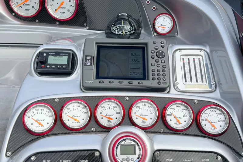 Slide: The Image of Dashboard of a 2011 Sunsation F4 boat with gauges and navigation system. - 53